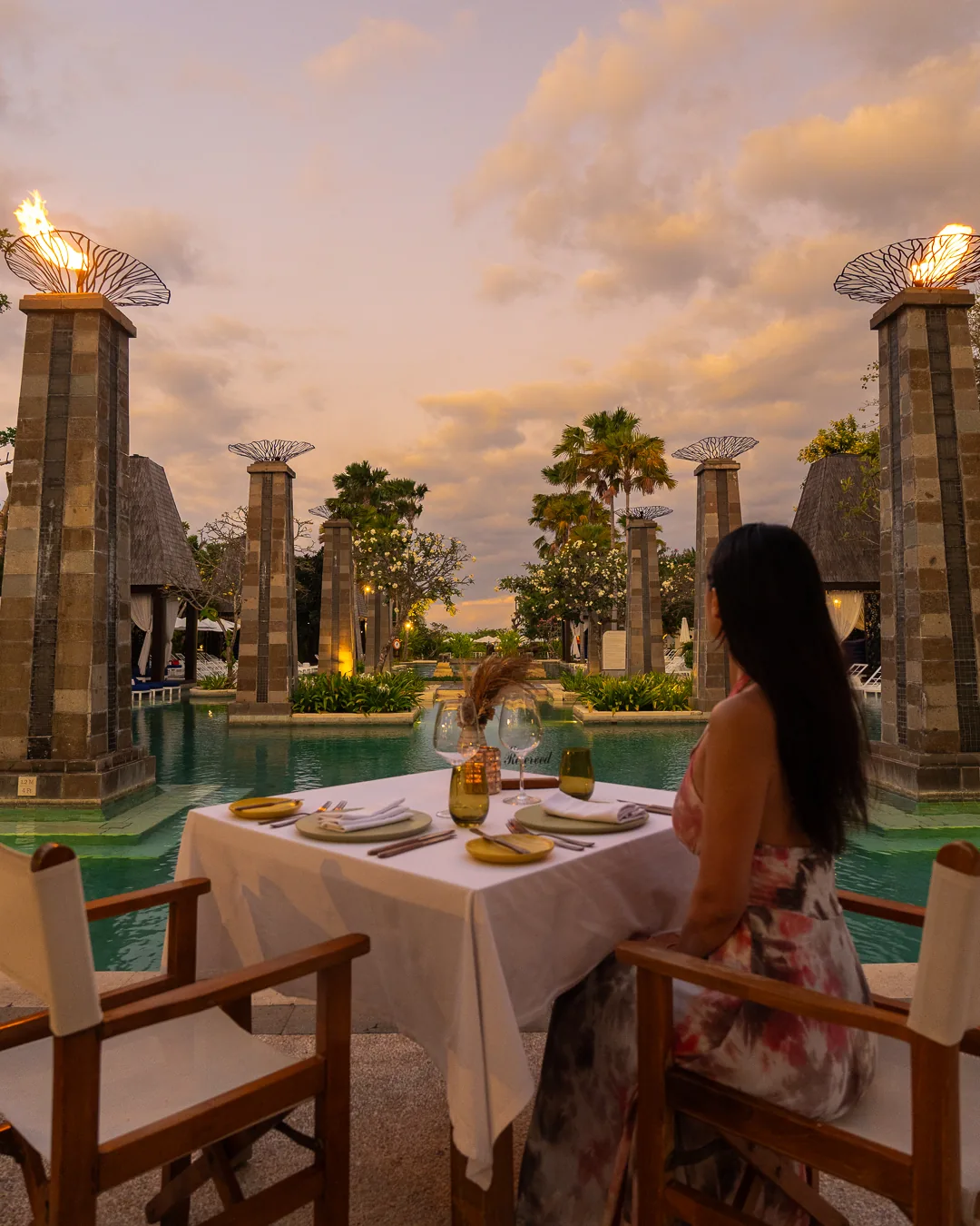 Dinner by the lagoon pools at dusk, Bali