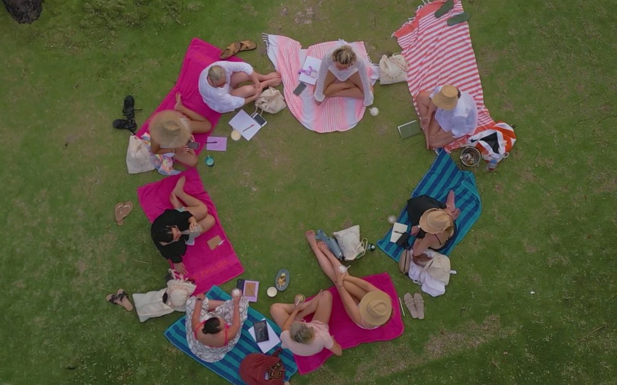 Women sharing an informal conversation together in Fiji in 2022