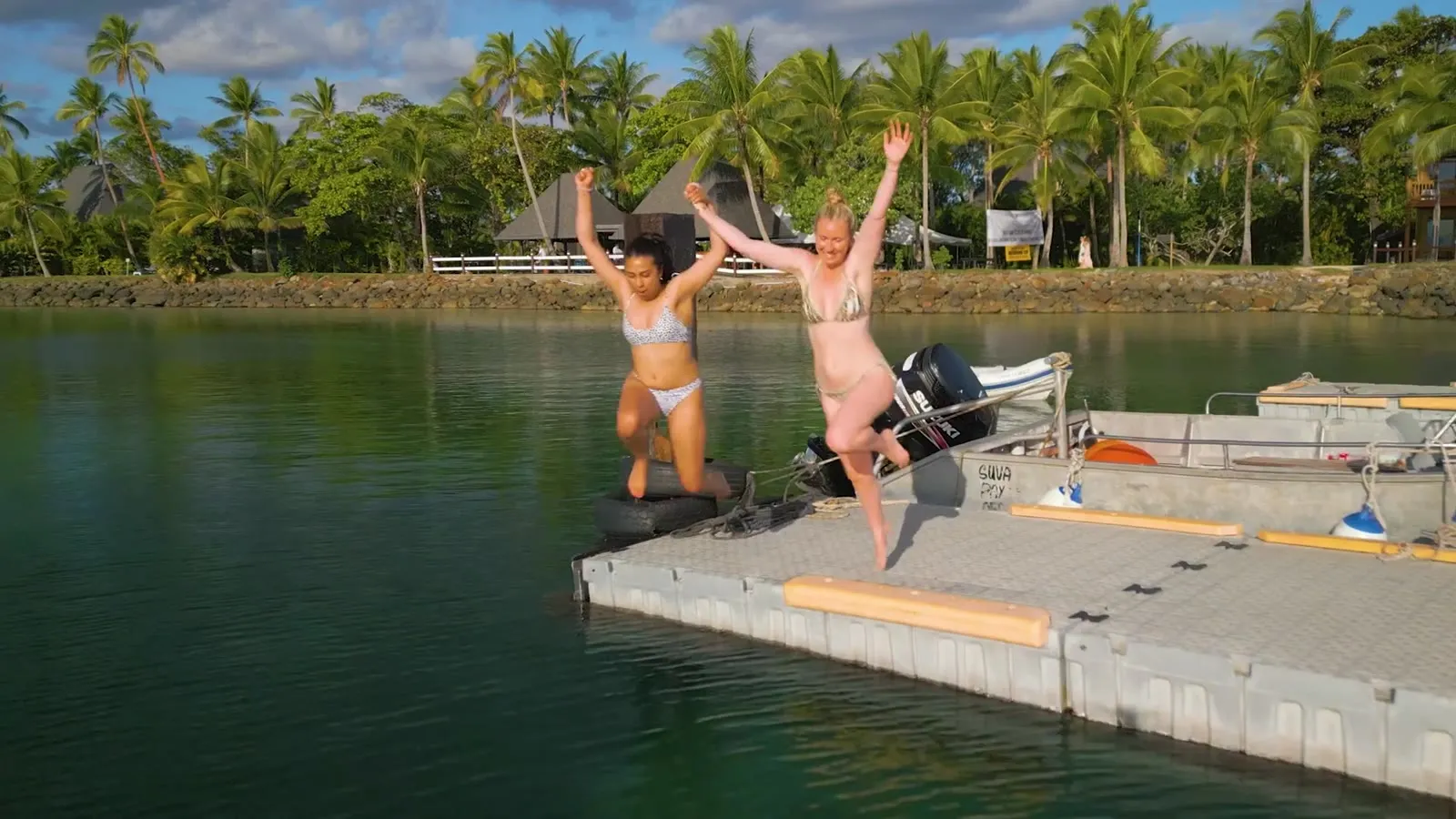 Women jumping off the jetty, Fiji 2022